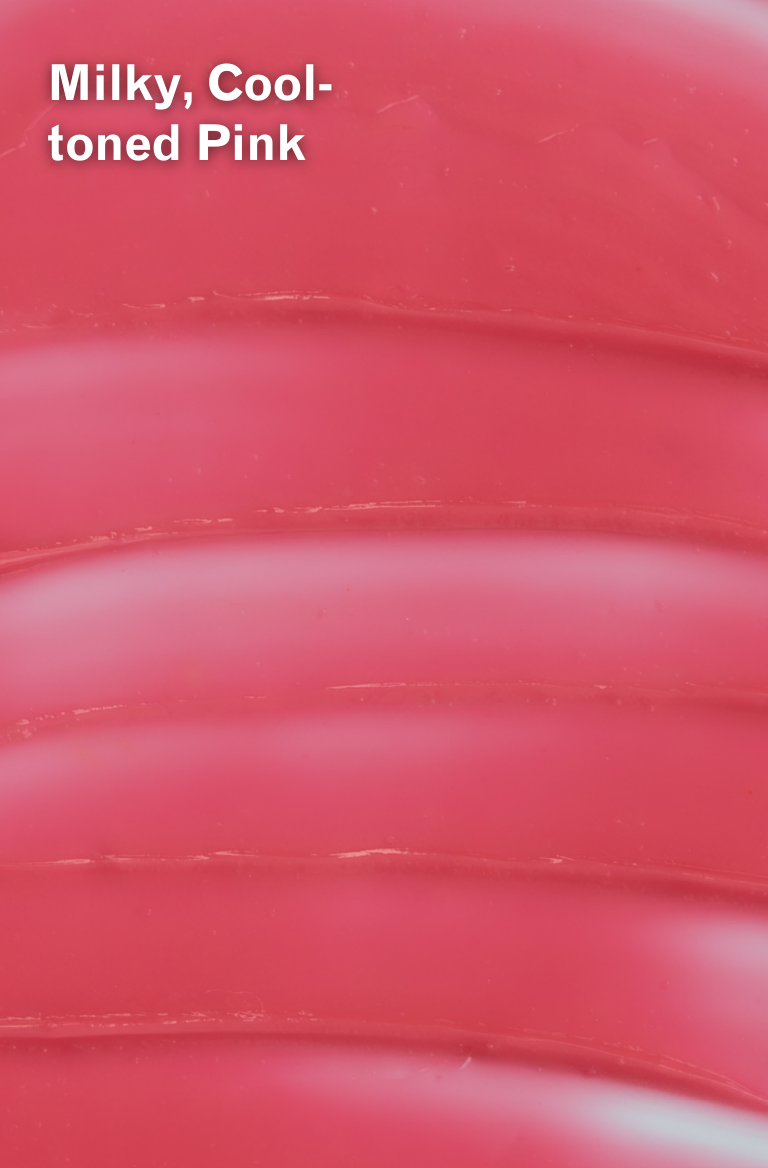 Close-up of a Bag Balm Powder Pink Lip Moisturizer Swatch with text 'Milky, Cool-toned Pink'.