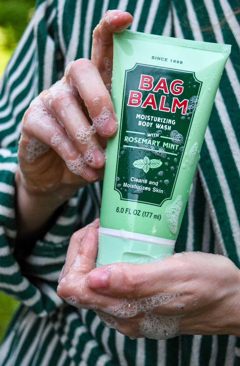 Body Wash Tube in hands with suds