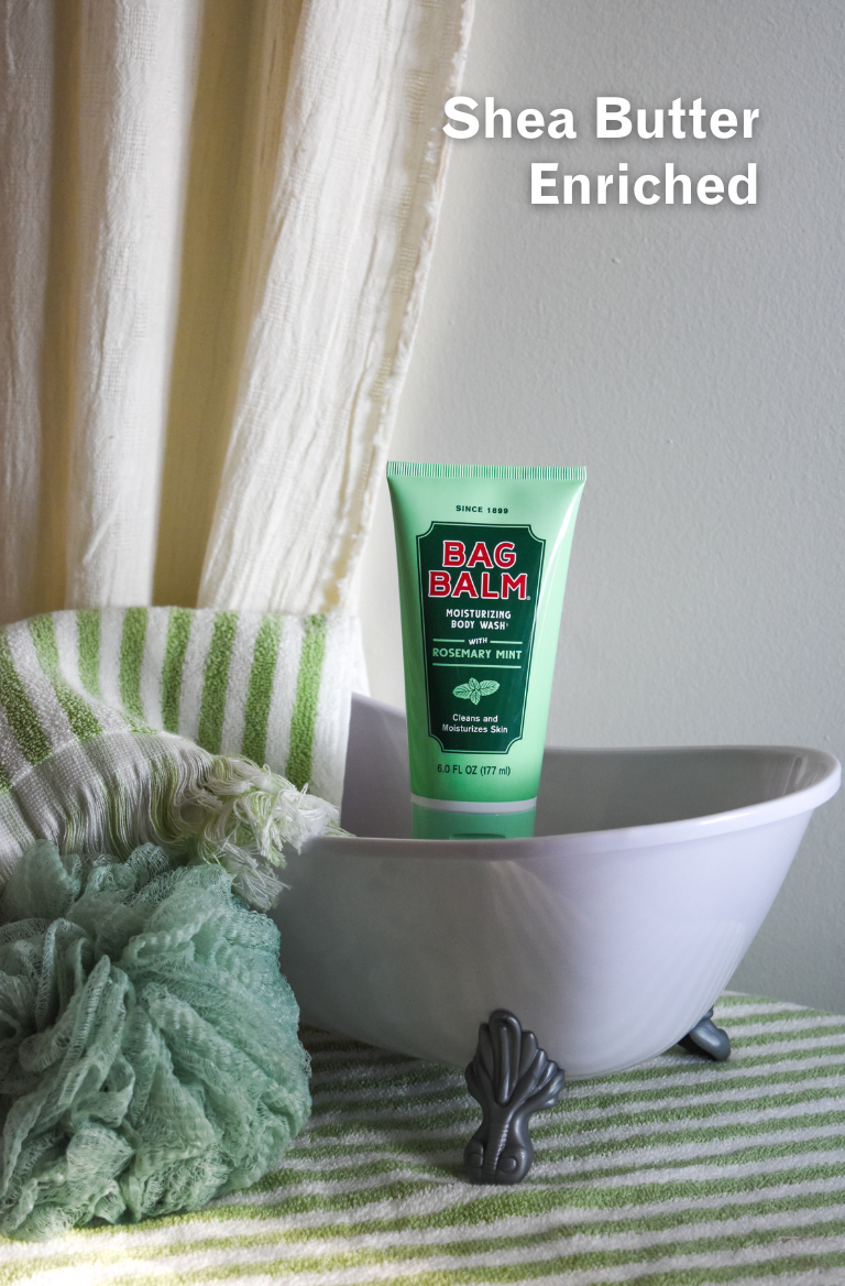 body wash in miniature bathtub with towel and loofa