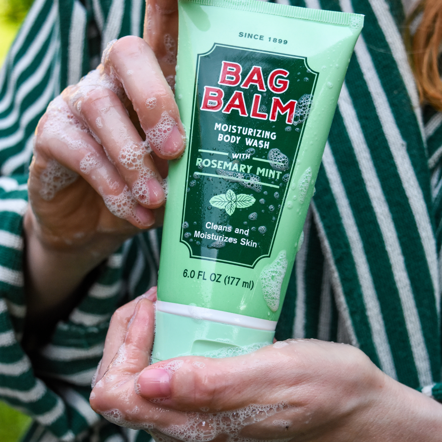 body wash in hands with suds