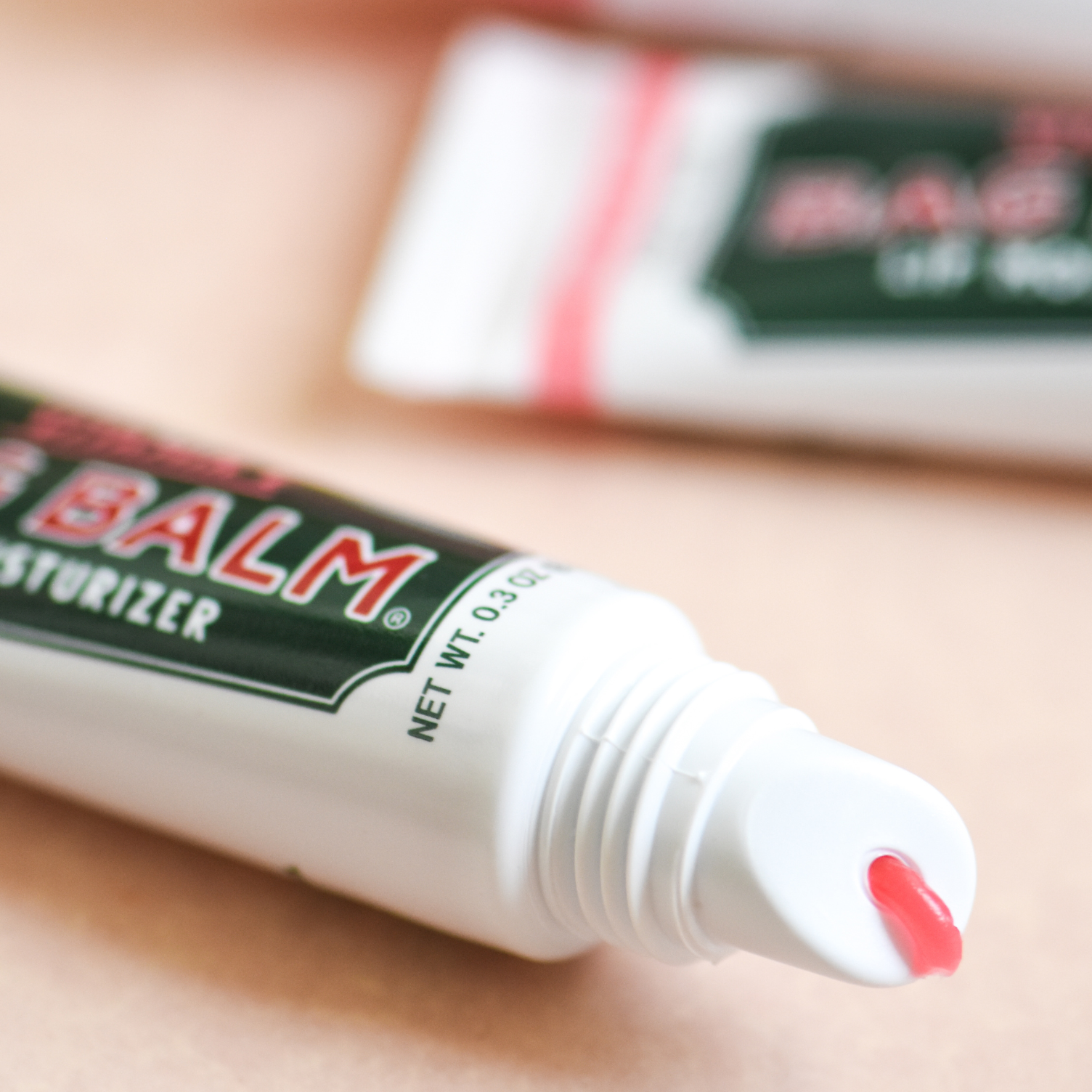 Tube of pink lip balm