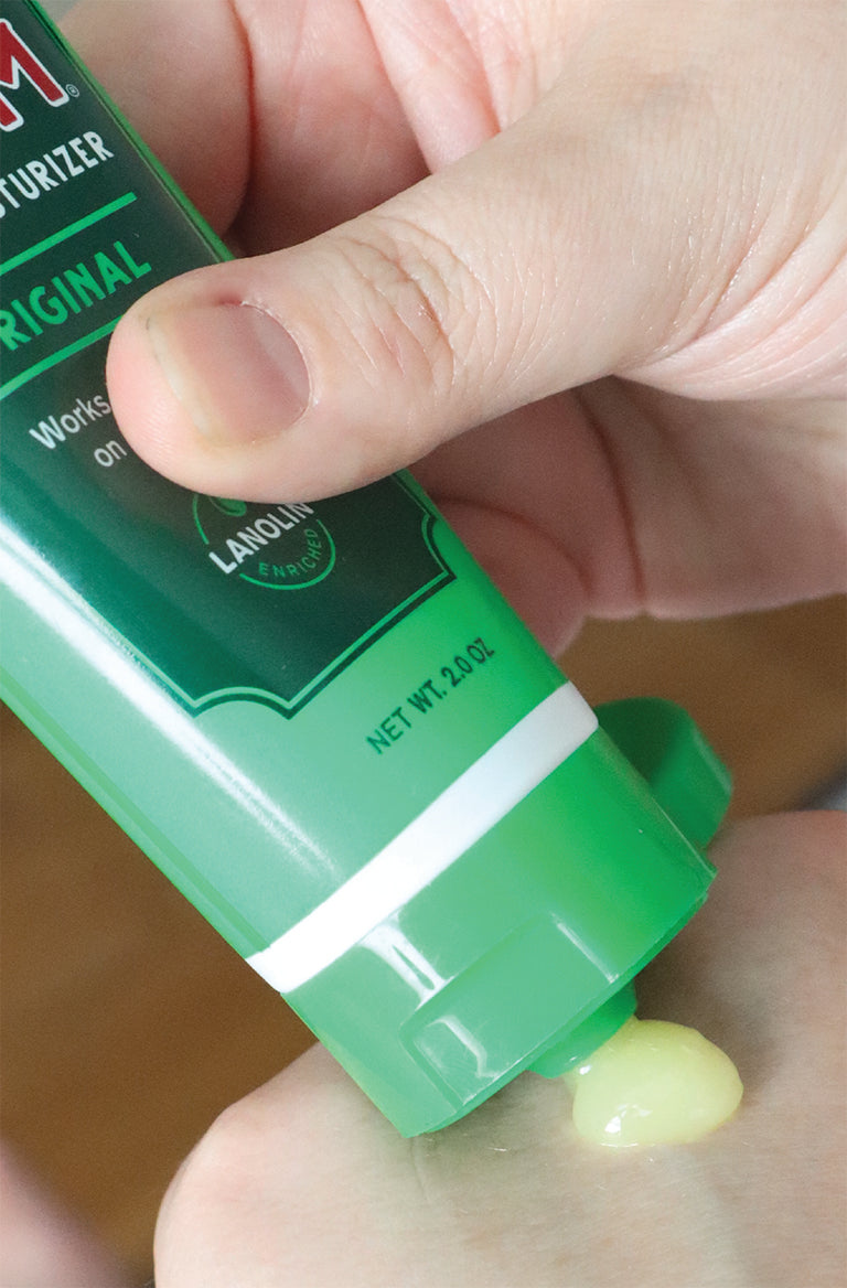 Bag Balm 2oz Tube squirting on skin