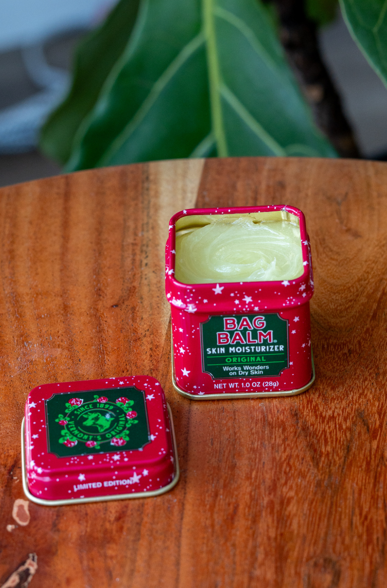 An open red with stars bag balm mini tin