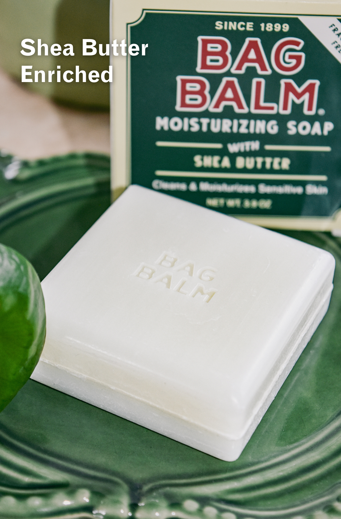 Bar of soap in green soap dish