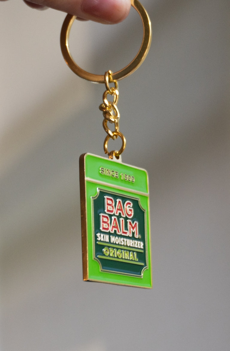 Keychain shaped like Bag Balm tin