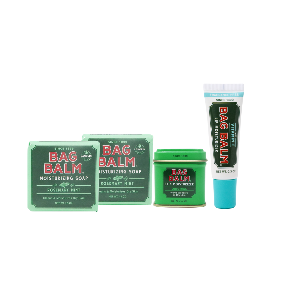Collection of Bag Balm products including a stick, bar, and tin on a white background