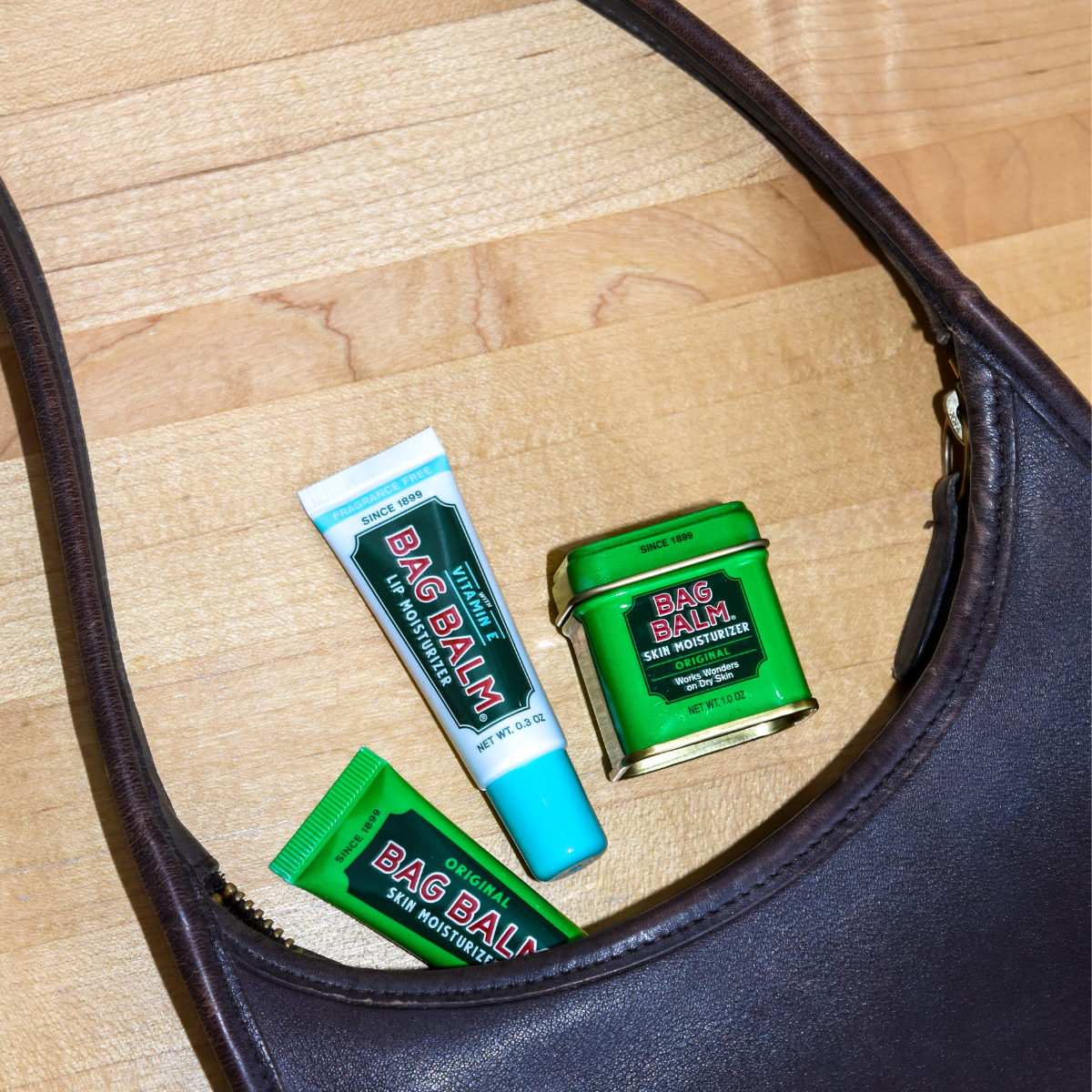 Bag Balm products coming out of purse
