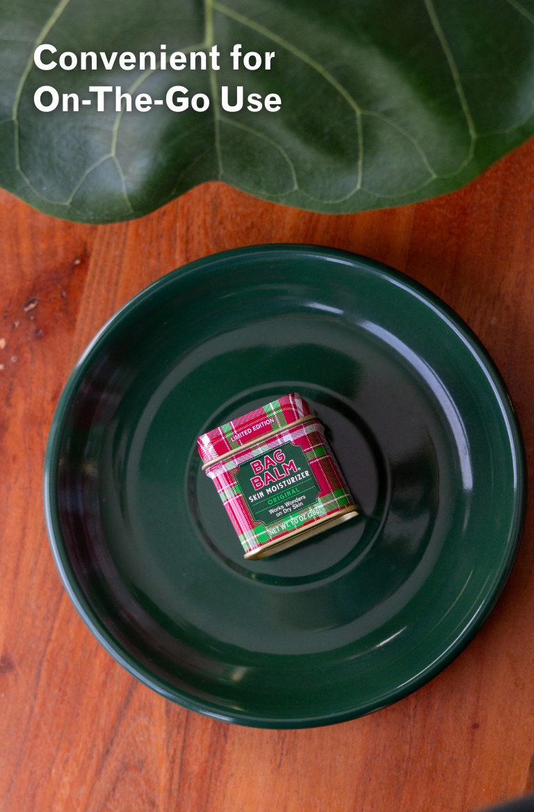 Limited edition Bag Balm mini tin on a green plate